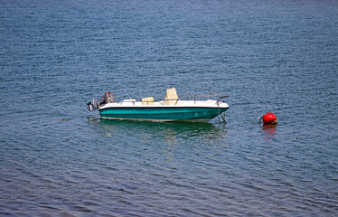 Boat or fishing boat anchored near the beach