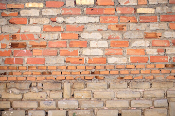 Old wall made of red brick and cement. Background for design.