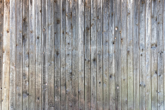 Grey barn wooden wall planking texture. hardwood dark weathered timber surface. old solid wood slats rustic shabby gray background. grunge faded wood board panel structure, close up