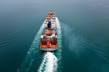 cargo container ship sailing in sea import and export business and industry logistic goods...