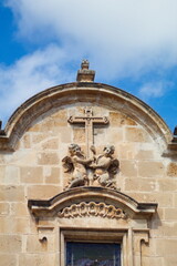 Fototapeta na wymiar Nice baroque facade with sculpture of the Iglesia de Santa Eulalia in Murcia on a sunny day 