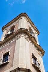 Fototapeta na wymiar Beautiful high tower with bell tower in the baroque church of Santa Eulalia in Murcia 