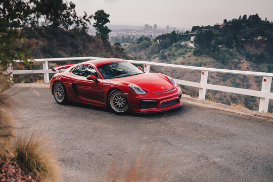 Los Angeles, USA - August 2021: Porsche Cayman GT4 finished in red.