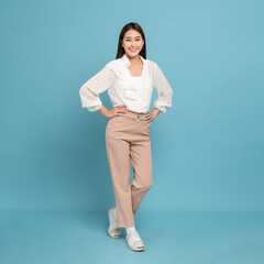 Young beautiful asian woman with smart casual cloth smiling isolated on blue background