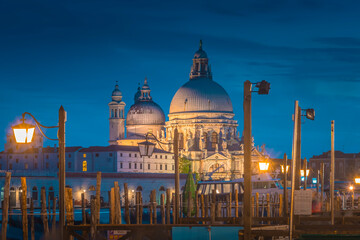 Fototapeta na wymiar The beautifully illuminated Basilica Santa Maria della Salute in Venice, Italy 