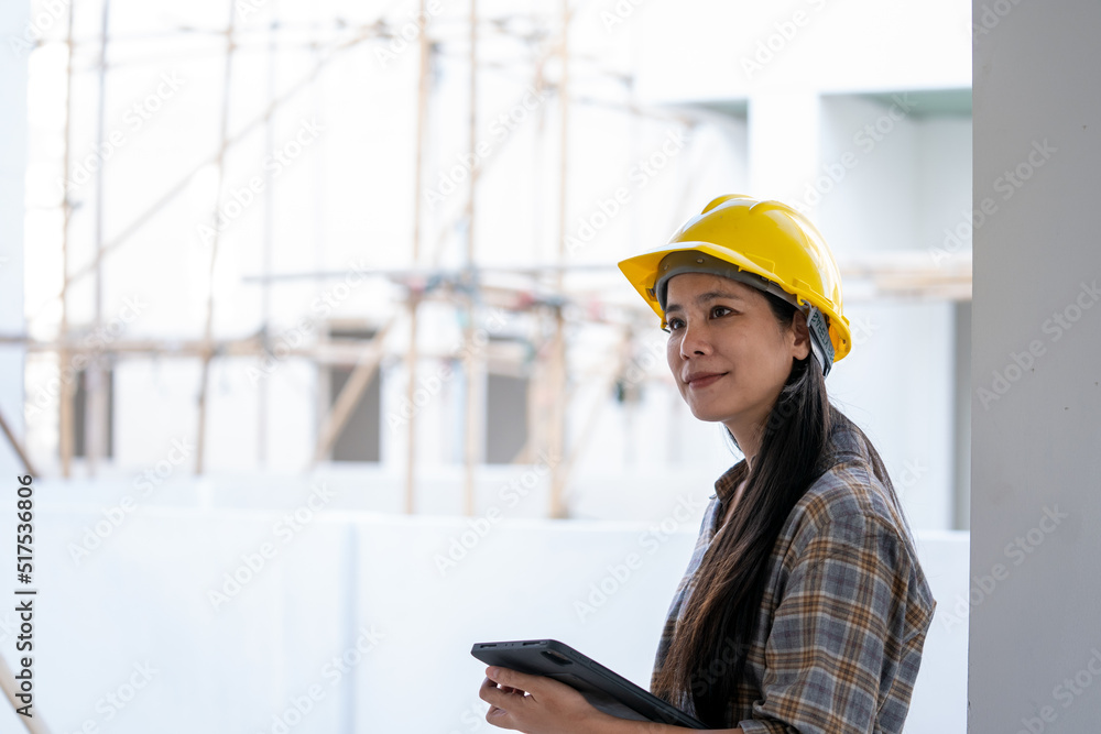 Aufkleber architect woman using tablet while working in the construction site.