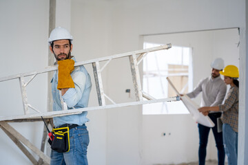 Construction workers collaborating on new house building,Concept of architect profession and house building.