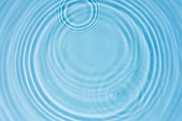Blue water texture, blue mint water surface with rings and ripples. Spa concept background. Flat...