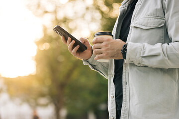 Unrecognizable male hands uses phone texting message, browsing surfinf internet tapping scrolling swipe up social media browsing isolated technology application