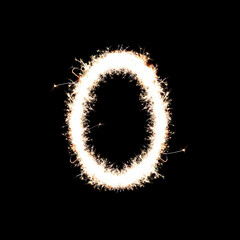 Sparkling sparkler in the shape of numbers on a black background. Fireworks, stars, flashes of...