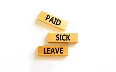 Paid sick leave symbol. Concept words Paid sick leave on wooden blocks. Beautiful white table white background. Business medical and paid sick leave concept. Copy space.