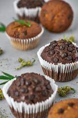 Cropped view of cupcakes with green marijuana