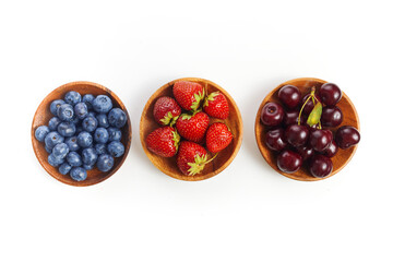 Berries mix in in a bowls on white background
