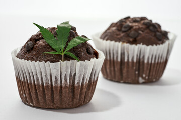 Marijuana leaf on cupcake with other blur cupcake