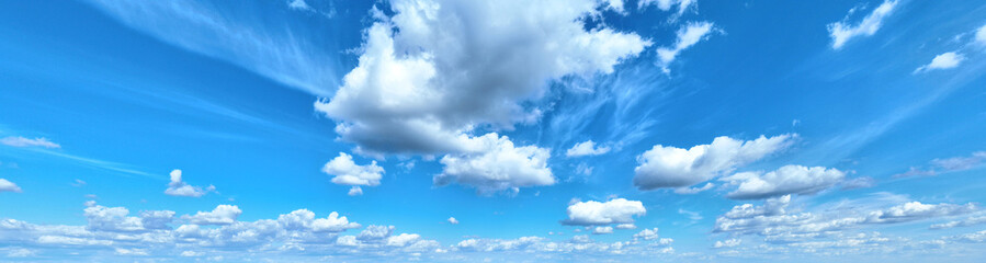 White clouds against blue sky background