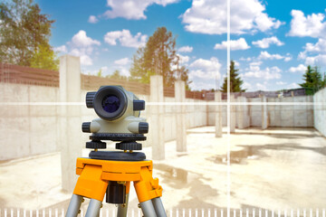 Optical level. Theodolite for geodetic works. Geodetic instrument on tripod. Deep concrete...