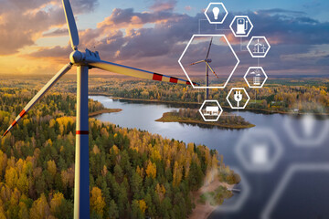Windmills over river. Wind turbines for power generation. White windmills before sunset. Concept of...