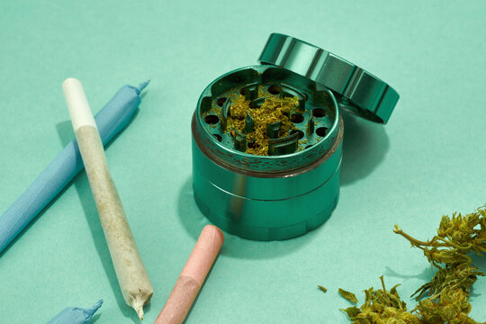 Partial of jar with marijuana and rolled joints