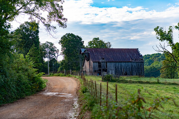 Scenic Farm Scene with old Barn on a hill