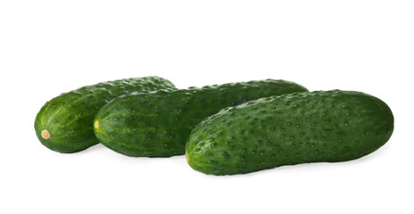 Whole fresh green cucumbers on white background