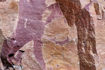 Fototapeta premium Texture. Chip of a large stone of red granite