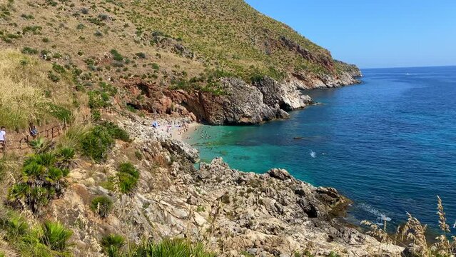 Paradise beach and turquoise sea at "Cala Capreria" into natural reserve &ldquo;Riserva dello Zingaro&rdquo;, Scopello, Sicily, Mediterranean Sea, Italy.