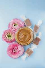 Jar with caramel and caramel candy