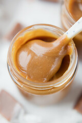 Caramel sauce and spoon close up