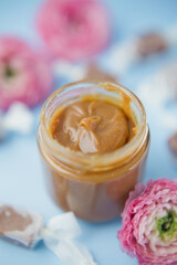 Jar with caramel and caramel candy
