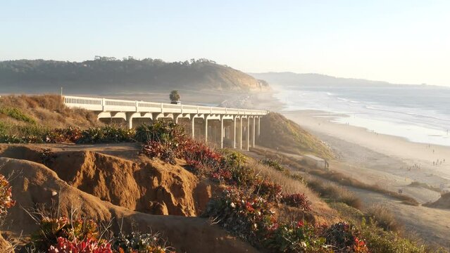 Bridge on pacific coast highway 1, Torrey Pines state beach, Del Mar, San Diego, California USA. Coastal road trip vacations, sunset seat scenic vista view point. Roadtrip on freeway 101 along ocean.