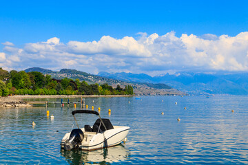 Fototapeta na wymiar View of Lake Geneva with boats in Lausanne, Switzerland