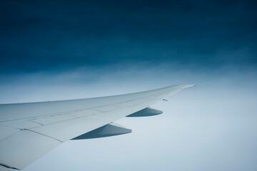 Commercial plane wing at high altitude 