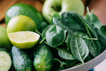 Green vegetables and fruits close-up, soft focus. Vegetarianism healthy lifestyle proper diet food