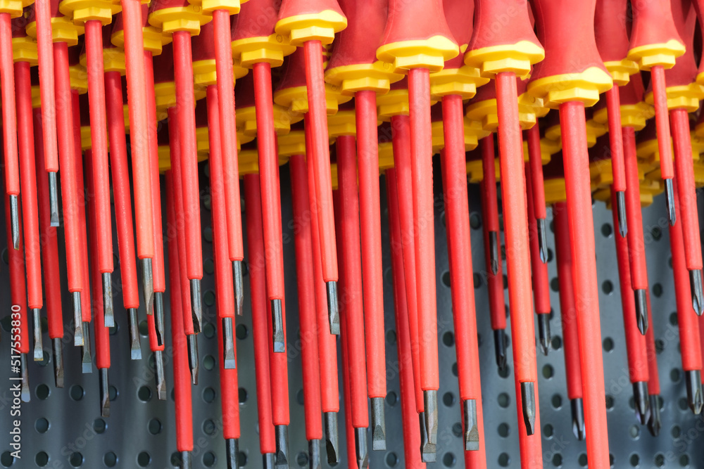 Poster screwdrivers on a showcase in a tool store, tool concept background