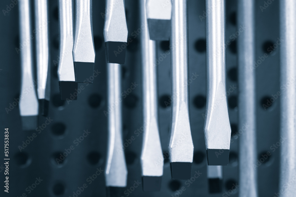 Poster screwdrivers on a showcase in a tool store, tool concept background