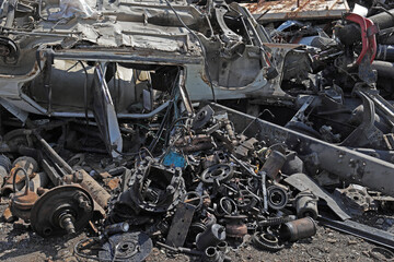 Scrap metal waste is stored in a recycling yard waiting to be melted down to manufacture new...