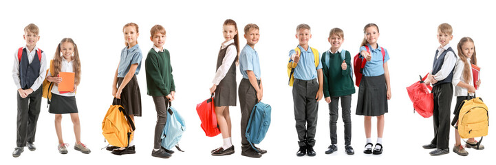 Obraz premium Set of funny little schoolchildren on white background