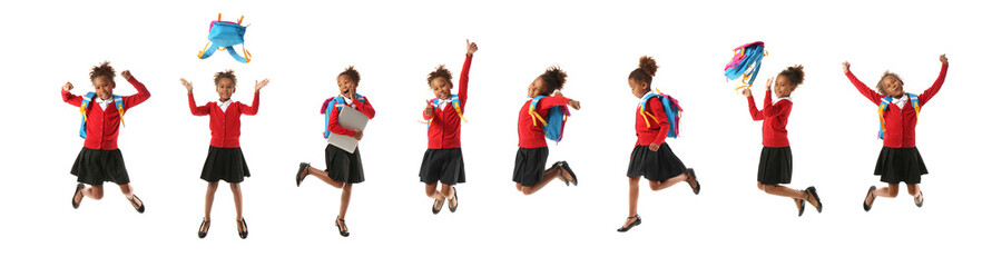 Set of jumping little African-American schoolgirl on white background