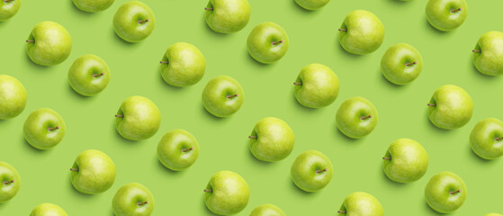 Fresh apples on green background. Pattern for design