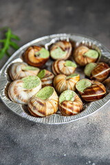 snails green garlic oil fresh healthy meal food snack on the table copy space food background rustic top view