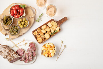 Appetizers table with different antipasti, charcuterie, snacks, cheese. Finger food for buffet...