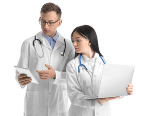 Medical assistants with laptop and tablet computer on white background