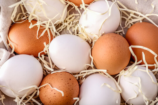 White And Brown Chicken Eggs On Table, Closeup