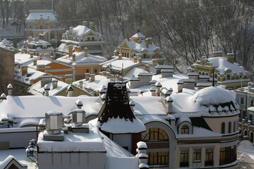 A example of energy efficiency. Quality insulated roofs and attics of buildings. Due to the well-thought-out thermal insulation system, the heat does not dissipate. Layer of snow on the roofs as proof