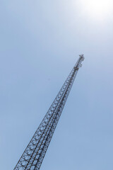 Electric transmission line mast, bottom view, against the sky