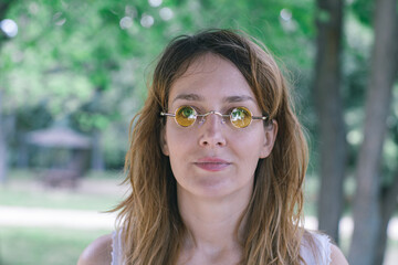 young woman with yellow round glasses