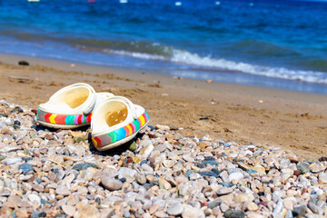 flip flops on the sand