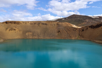 The crystal clear deep blue lake Krafla on Iceland.
