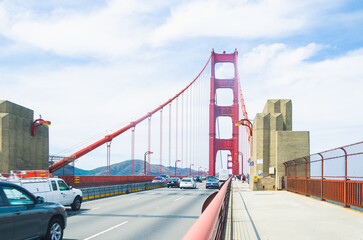 SAN FRANCISCO, CA,USA - 2015, JULY 1: Golden Gate bridge with cars, trucks, buses, pedestrians and...