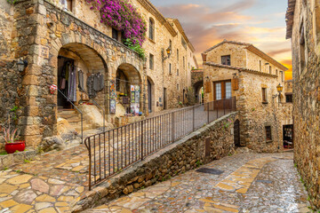 The medieval Spanish village of Pals in the Costa Brava region of Southern Spain as the sun sets after a summer rainstorm.